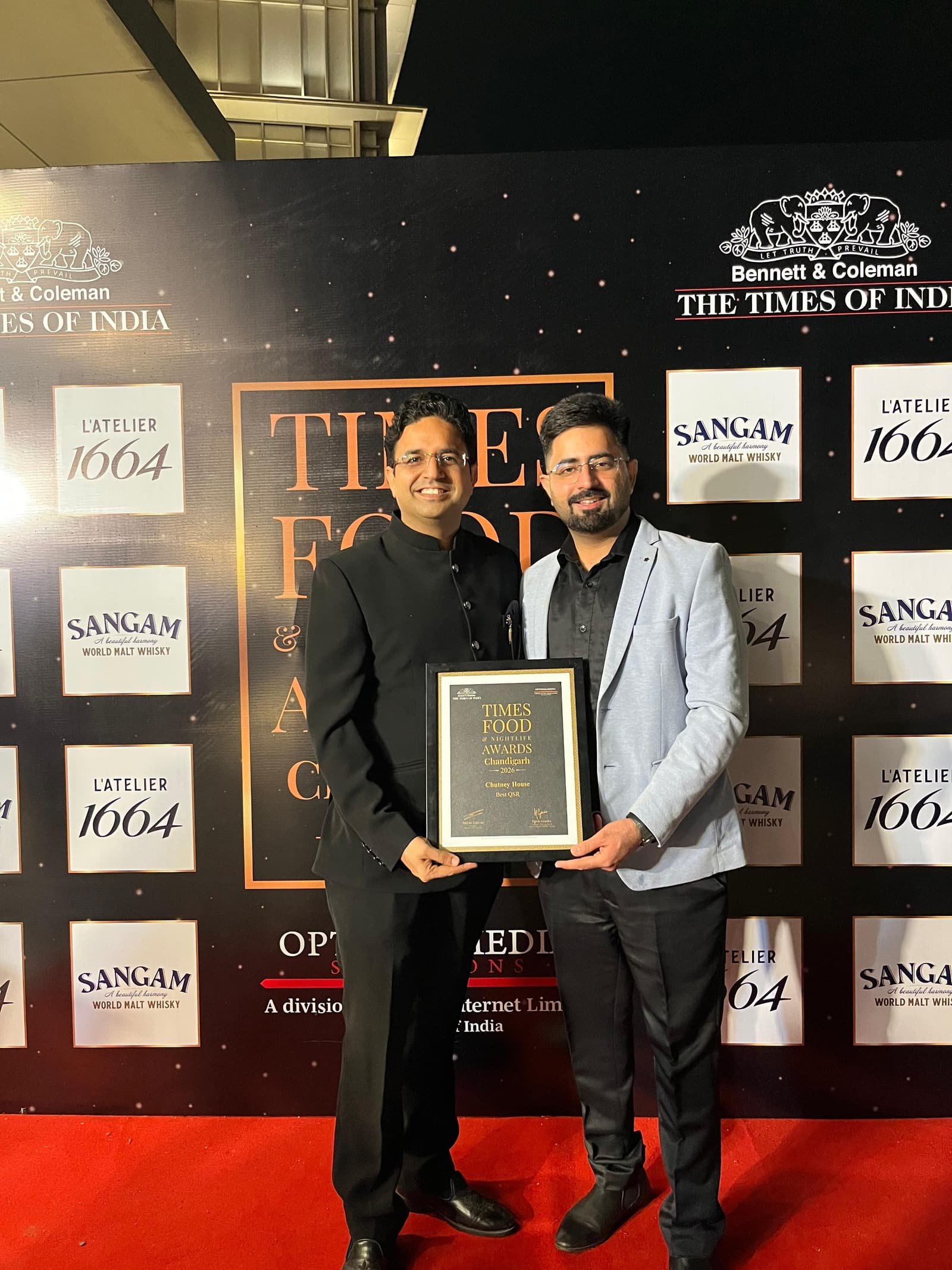 Chutney House team receiving the award on stage